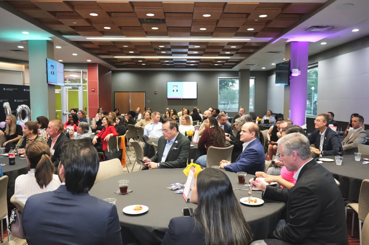 Conference attendees seated during a corporate event.