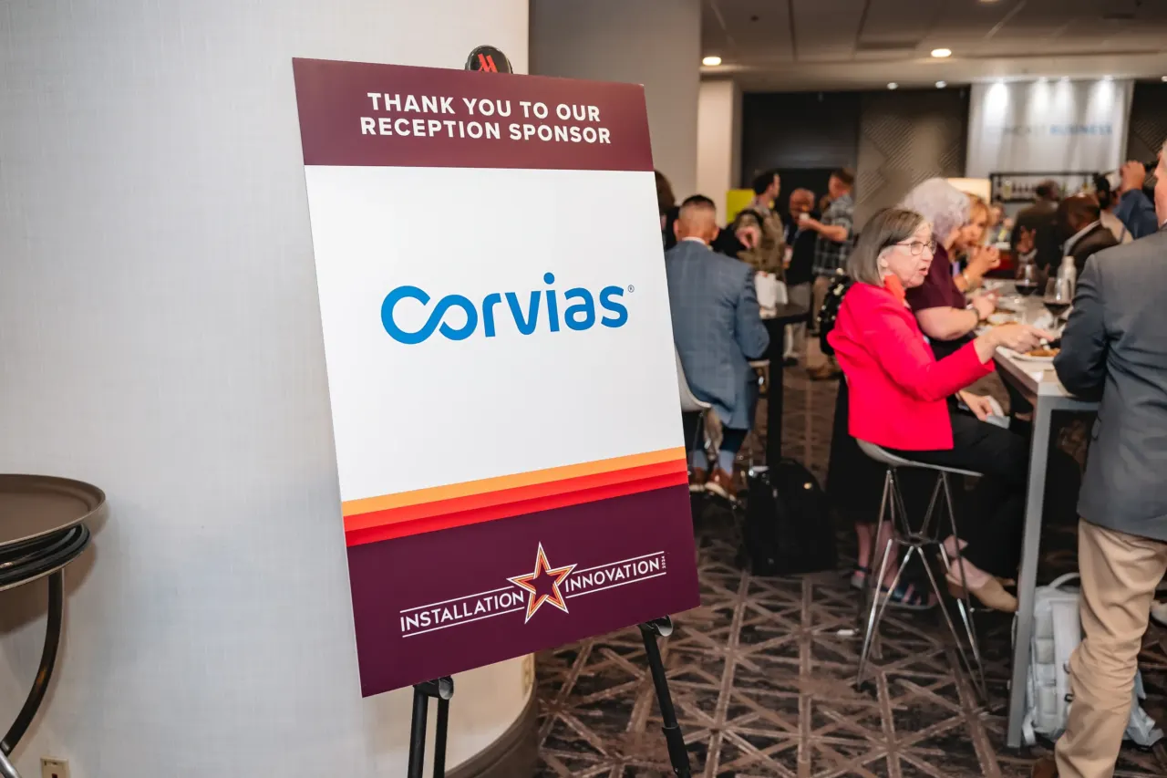Corvias sponsor display at an event reception.